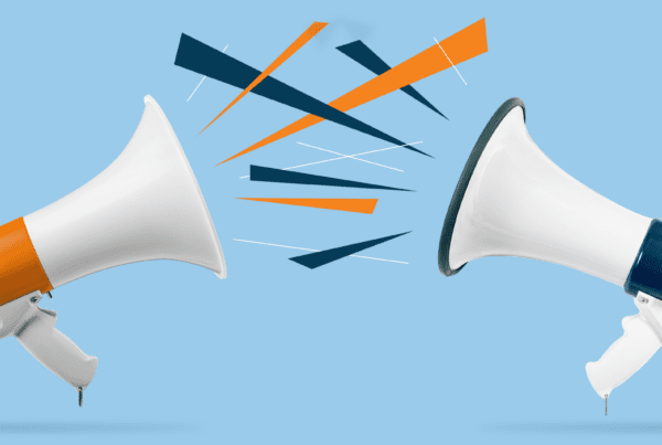 Two megaphones pointed to each other with noise icons spitting out, on top of a blue background