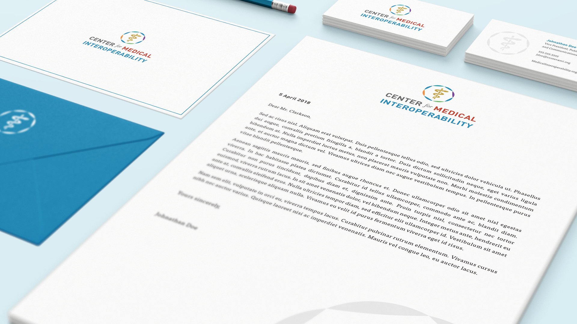 C4MI-Stationery-Mockup-Resized Multiple stacks of Center for Medical Interoperability stationery, including business cards and envelopes