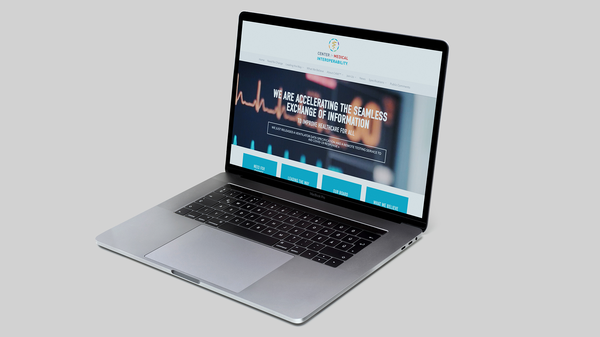 C4MI-Web-Mockup-Resized A laptop with the screen displaying a webpage from Center for Medical Interoperability