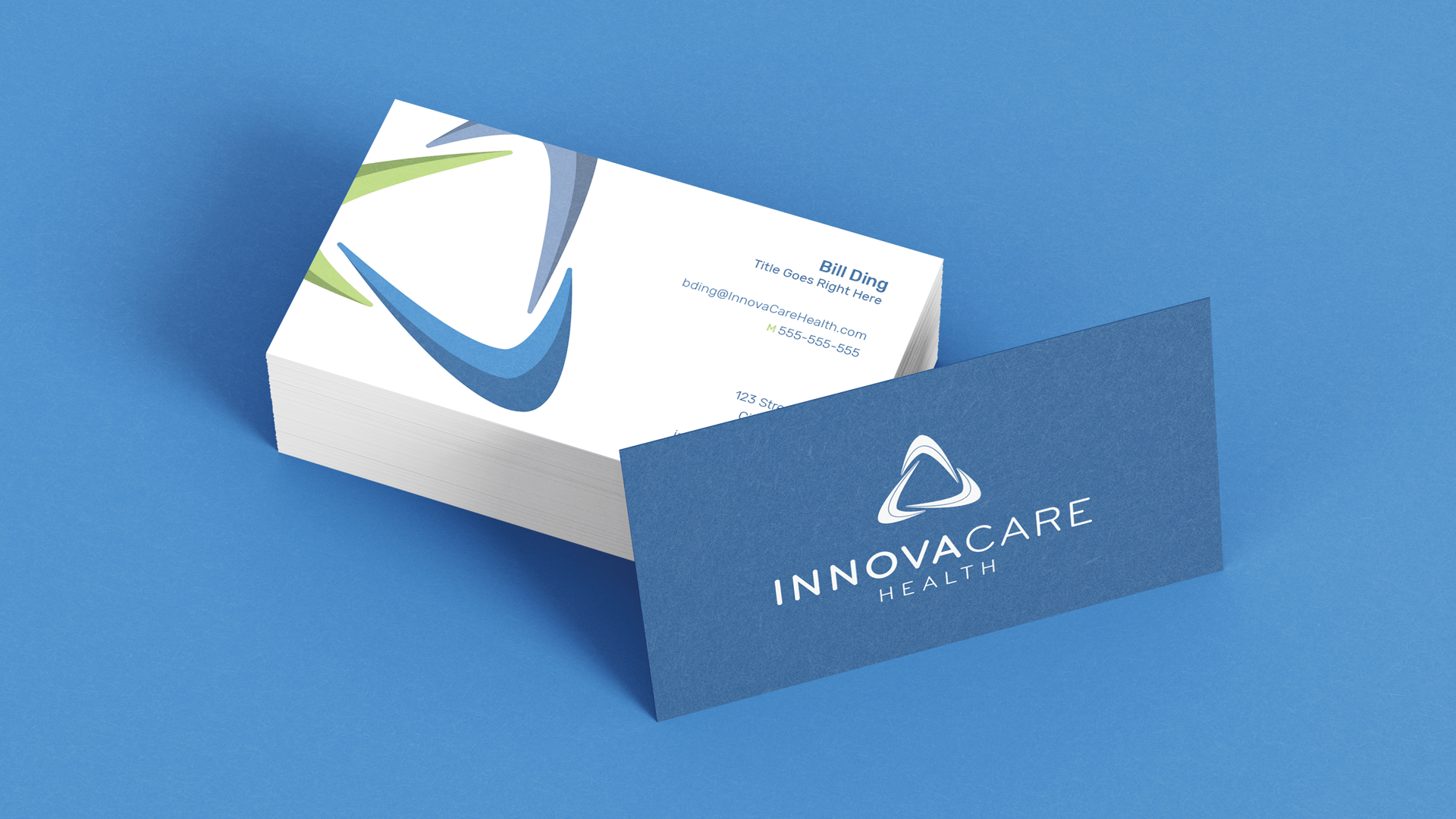 Innovacare-BC-Mockup-Resized A stack of business cards for Innovacare Health, with one standing up against the stack