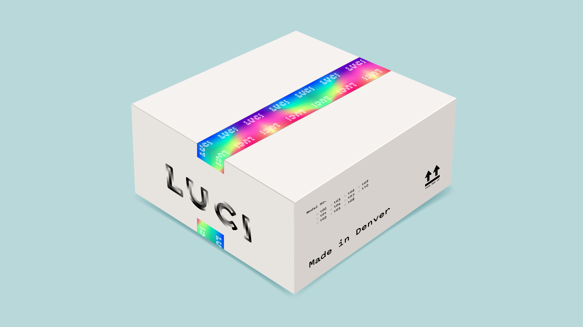 LUCI-Product-Box-Mockup A white product box with company name "LUCI" written on the side and packaged with rainbow tie-dye tape, floating on a light blue background