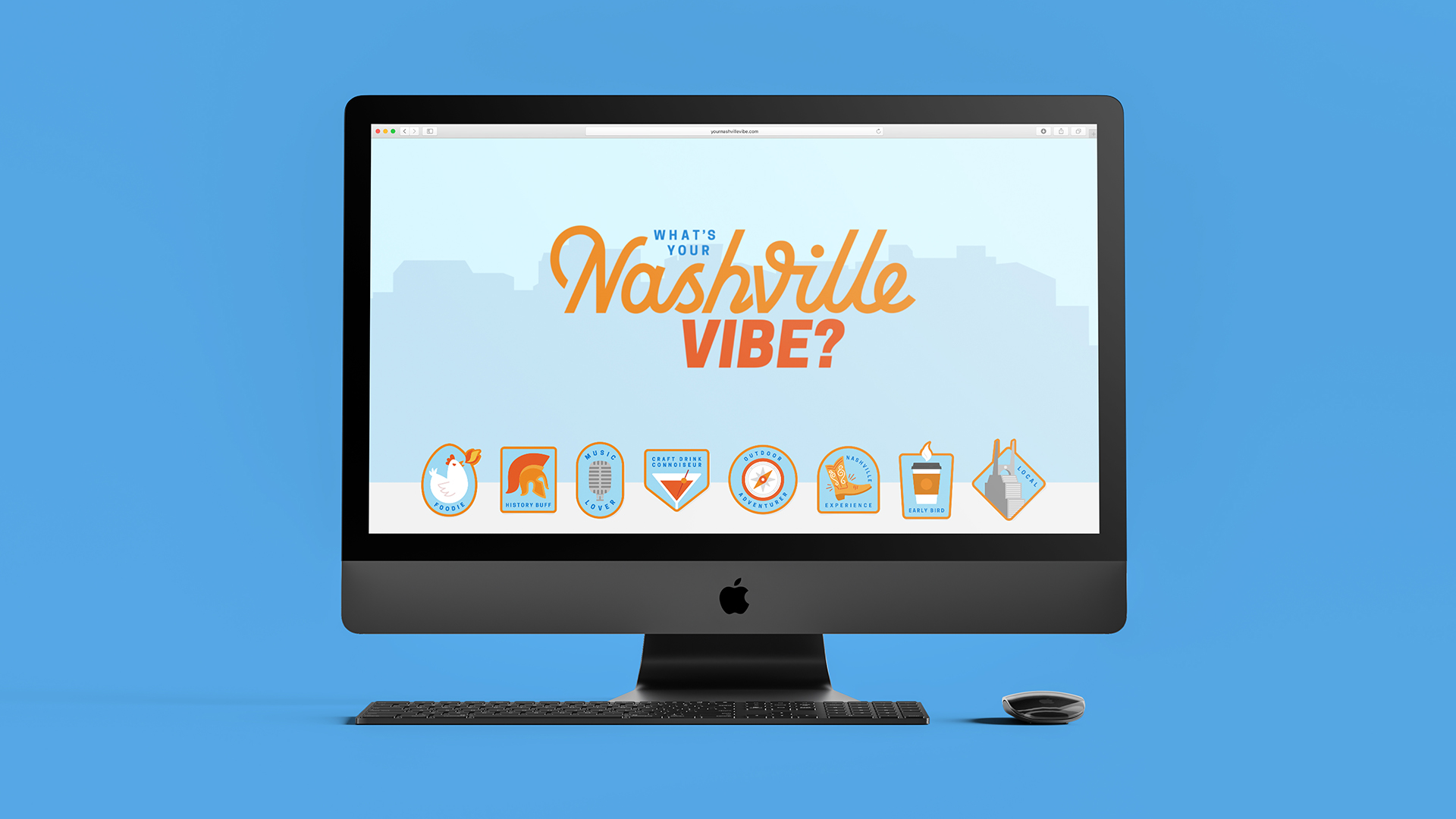 NashVibe-iMac-Home-Resized An apple desktop computer and keyboard with the screen displaying a webpage with text that reads "What's your Nashville vibe?"