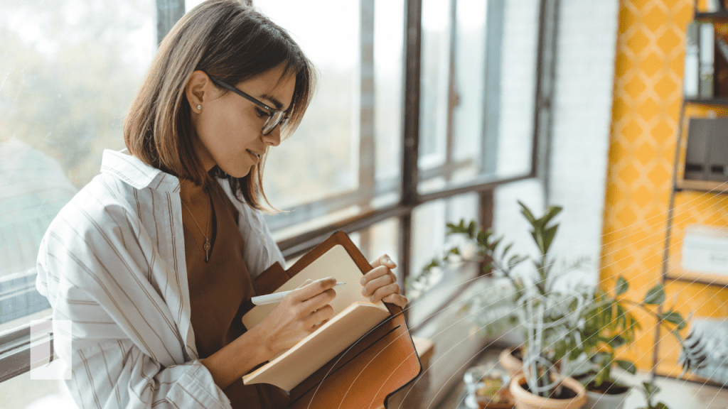 Woman writing in a journal